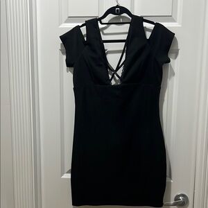 New with tags Bebe Black Bodycon Dress with Plunge Neckline and Cap Sleeves